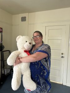 Alice holding a teddy bear